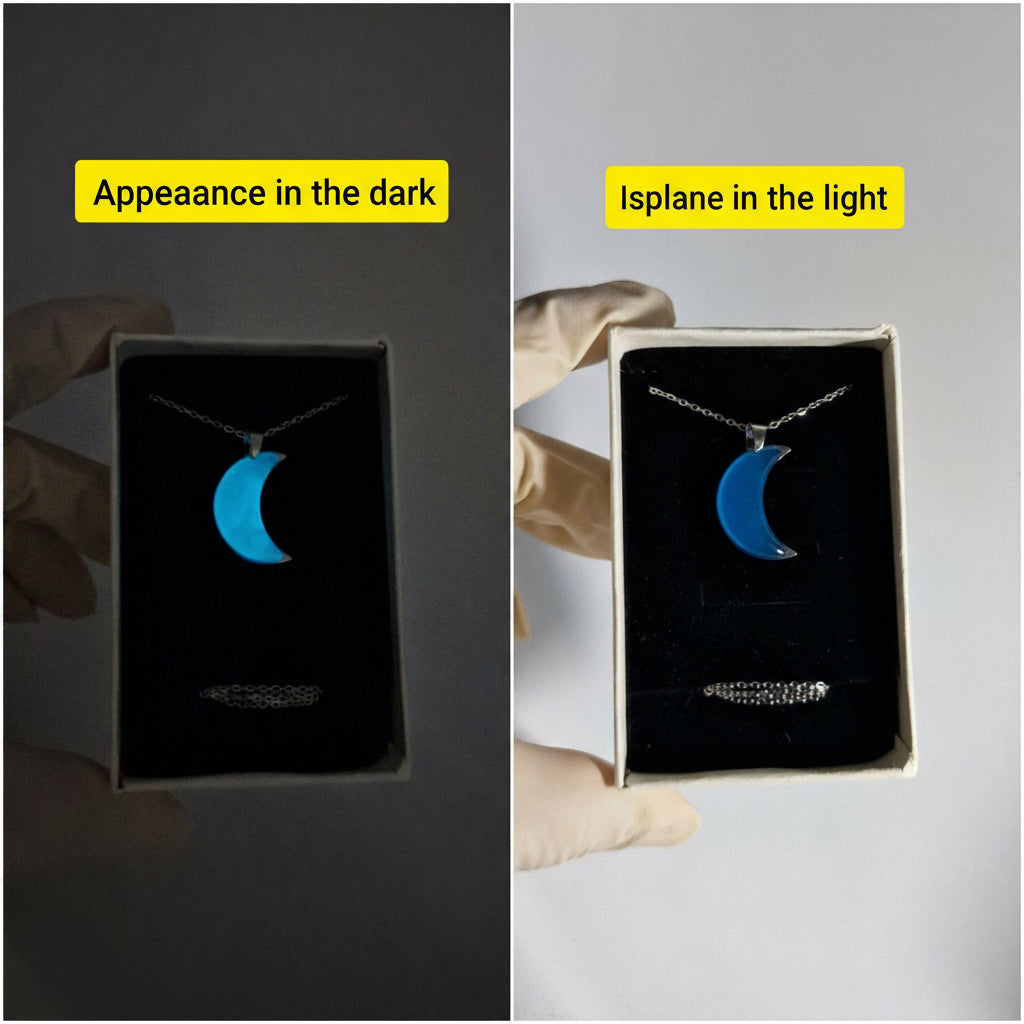 Jewelry box with a crescent moon necklace in dark and light conditions.